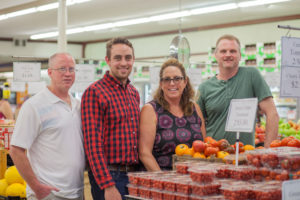Owners of Ken's Fruit Market in their store